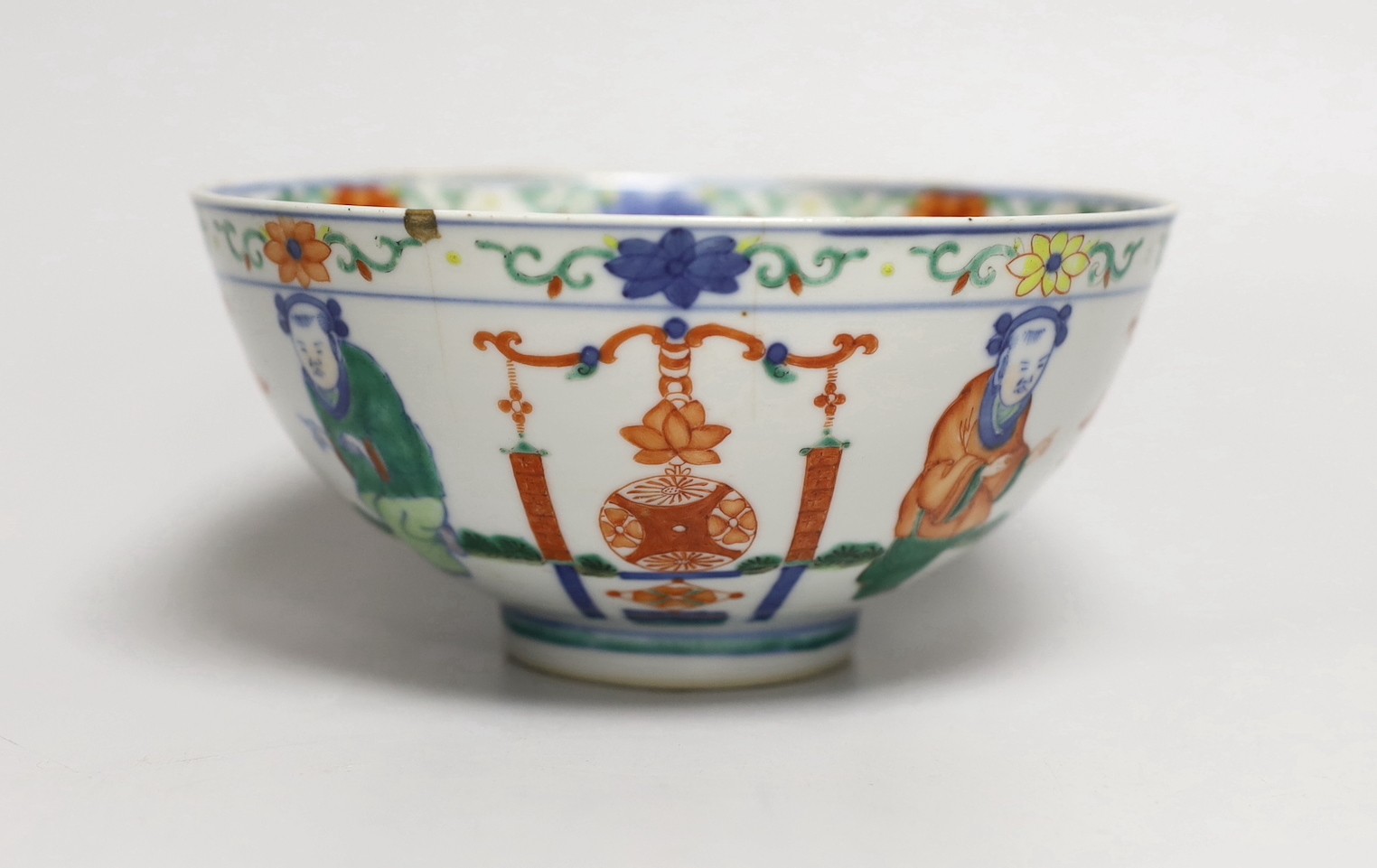 A Chinese wucai ‘boys’ bowl, Kangxi mark late 19th/early 20th century, dragon to the interior, 16.5cm diameter